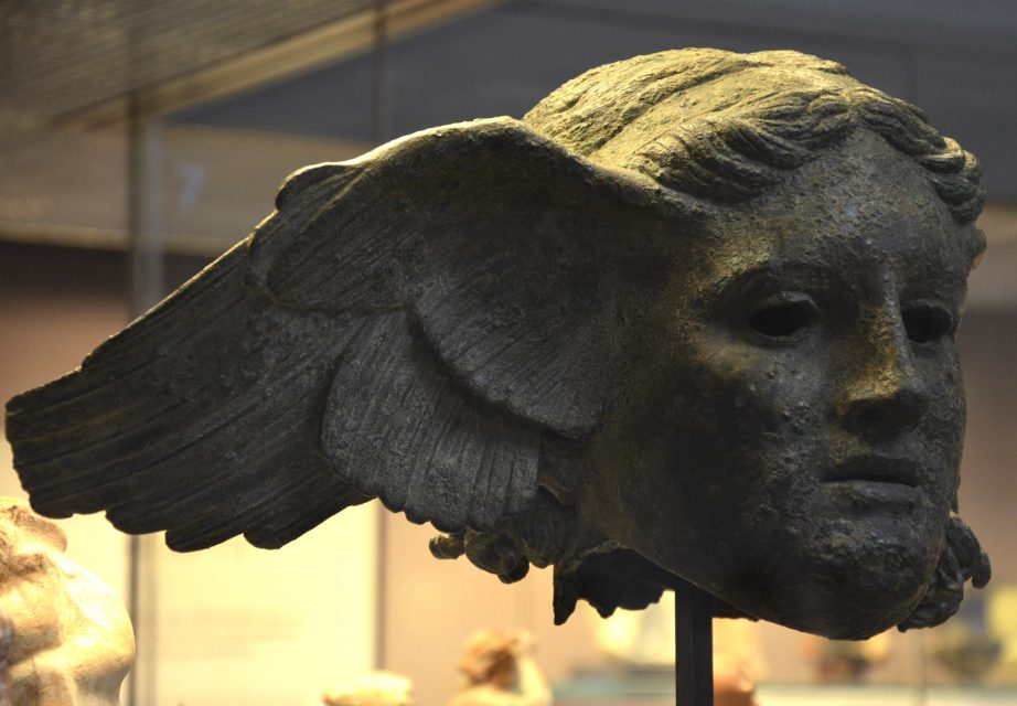 Roman copy of a Greek statue of Hypnos. Head with a single wing, held in the British Museum.