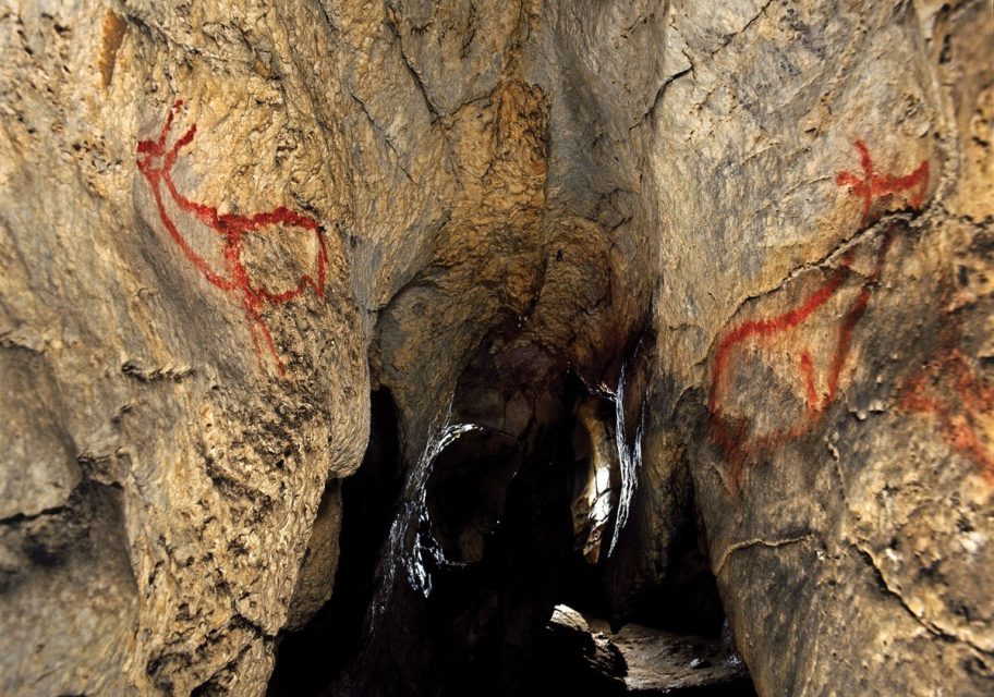 Covalanas Cave, Cantabria. Known for its vivid red ochre paintings of does, rendered with delicate outlines and rhythmic dotting.
