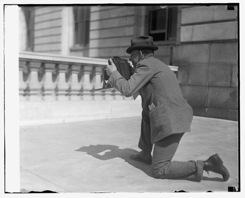 Keeping the camera level was one way of avoiding converging verticals. A. W. Leonard with a large-format camera, c. 1920s.