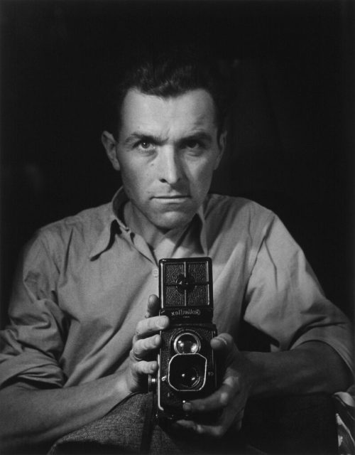 The waist-level viewfinder separates the camera from the photographer’s eye and allows a lower viewpoint. Robert Doisneau, Self-Portrait with Rolleiflex, 1947.
