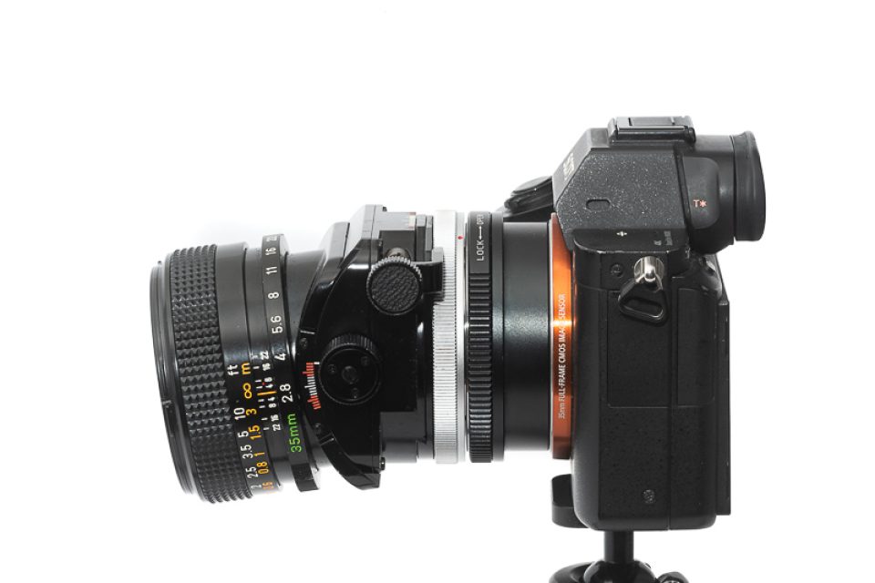 Shift lenses allow the camera to remain level while moving the field of view up or down. Canon TS 35mm f/2.8 S.S.C., introduced in 1973.