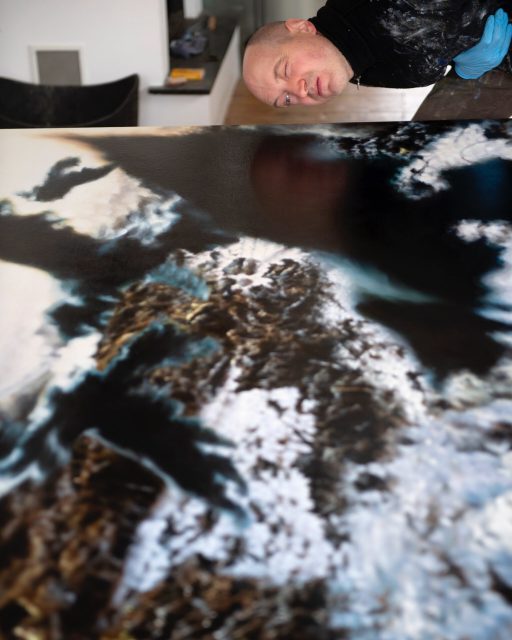 Philipp_Frohlich_Seven_Ravens Philipp Fröhlich checking the surface of his painting The Seven Ravens