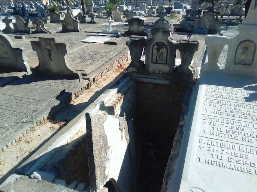 A broken sepulchre, revealing the architecture of the grave beneath the surface.